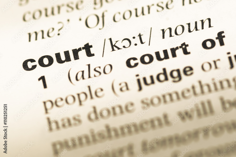 Close up of old English dictionary page with word court Close up of old English dictionary page with word court