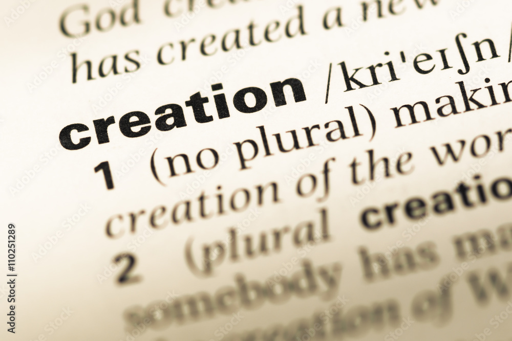 Close up of old English dictionary page with word creation Close up of old English dictionary page with word creation