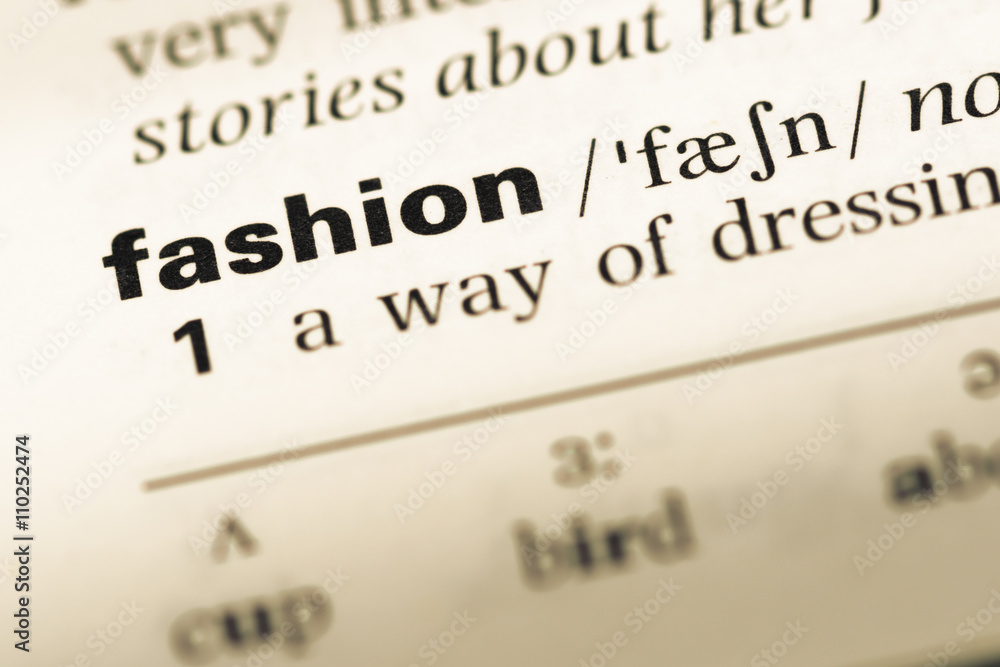 Close up of old English dictionary page with word fashion Close up of old English dictionary page with word fashion