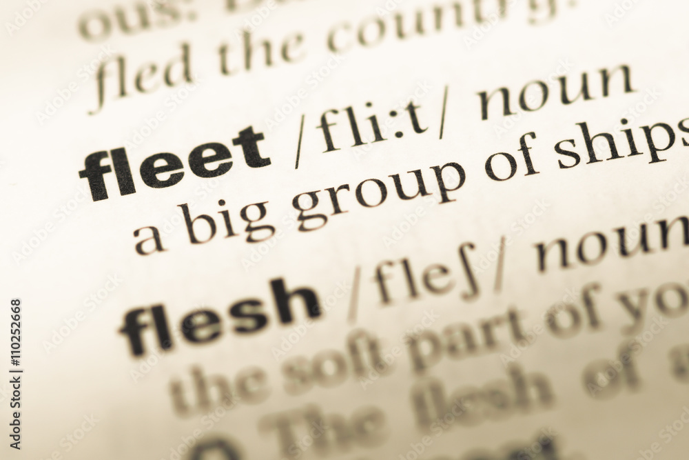 Close up of old English dictionary page with word fleet Close up of old English dictionary page with word fleet