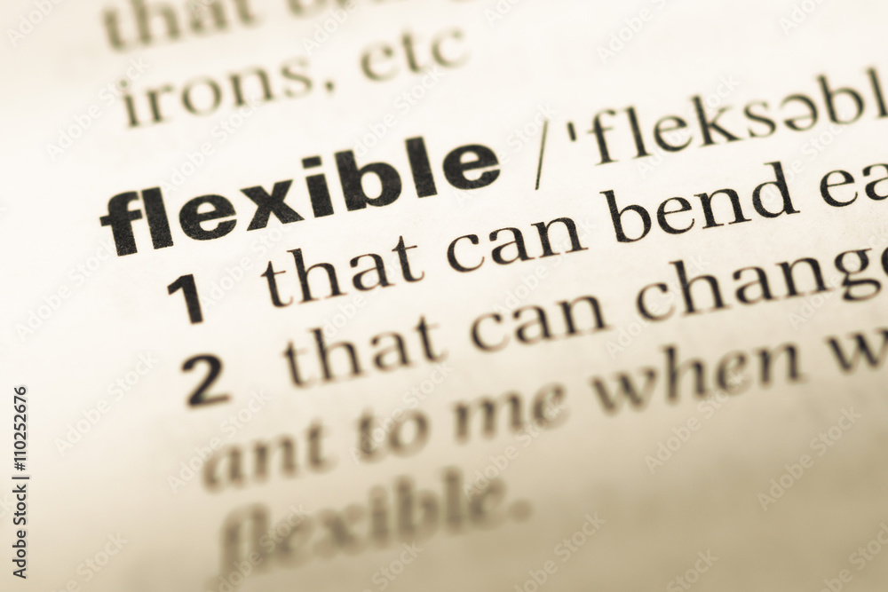 Close up of old English dictionary page with word flexible Close up of old English dictionary page with word flexible