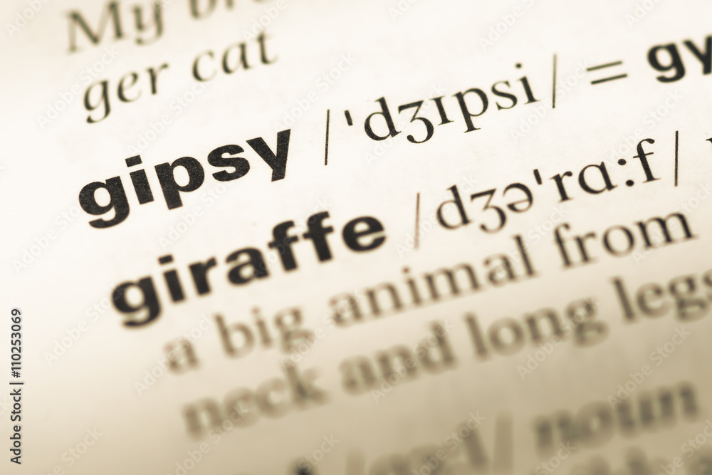 Close up of old English dictionary page with word gipsy Close up of old English dictionary page with word gipsy
