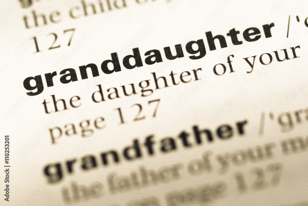 Close up of old English dictionary page with word granddaughter Close up of old English dictionary page with word granddaughter