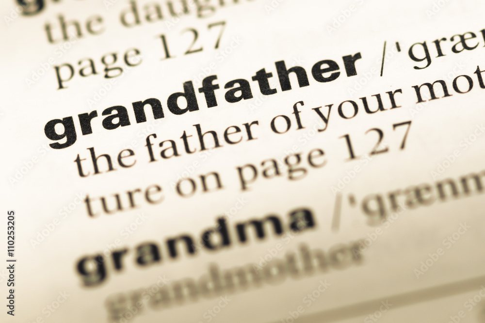 Close up of old English dictionary page with word grandfather Close up of old English dictionary page with word grandfather