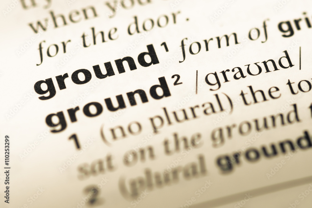 Close up of old English dictionary page with word ground Close up of old English dictionary page with word ground