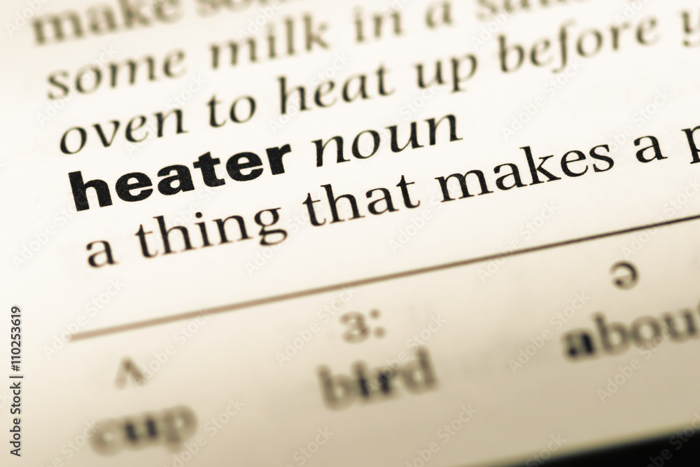 Close up of old English dictionary page with word heater Close up of old English dictionary page with word heater