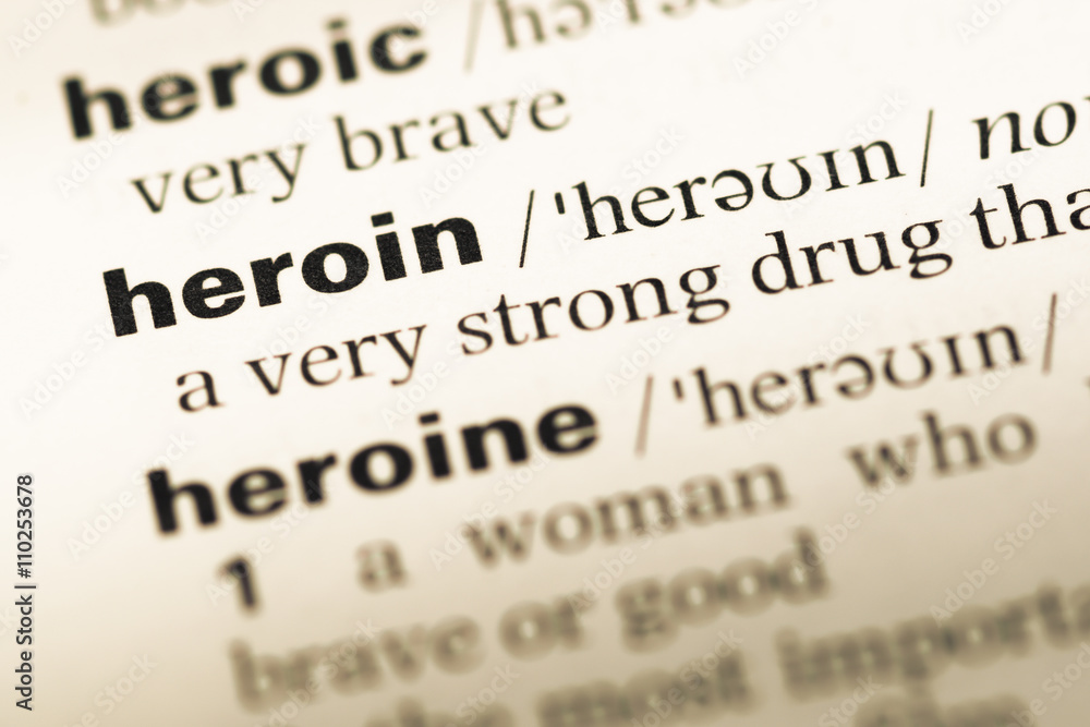 Close up of old English dictionary page with word heroin Close up of old English dictionary page with word heroin