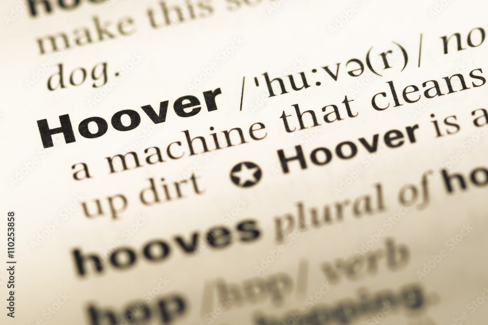 Close up of old English dictionary page with word hoover Close up of old English dictionary page with word hoover