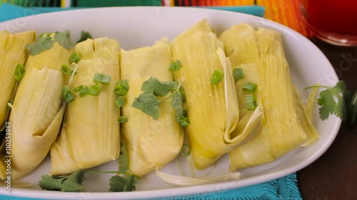 Home made tamales on serving plate on the party table