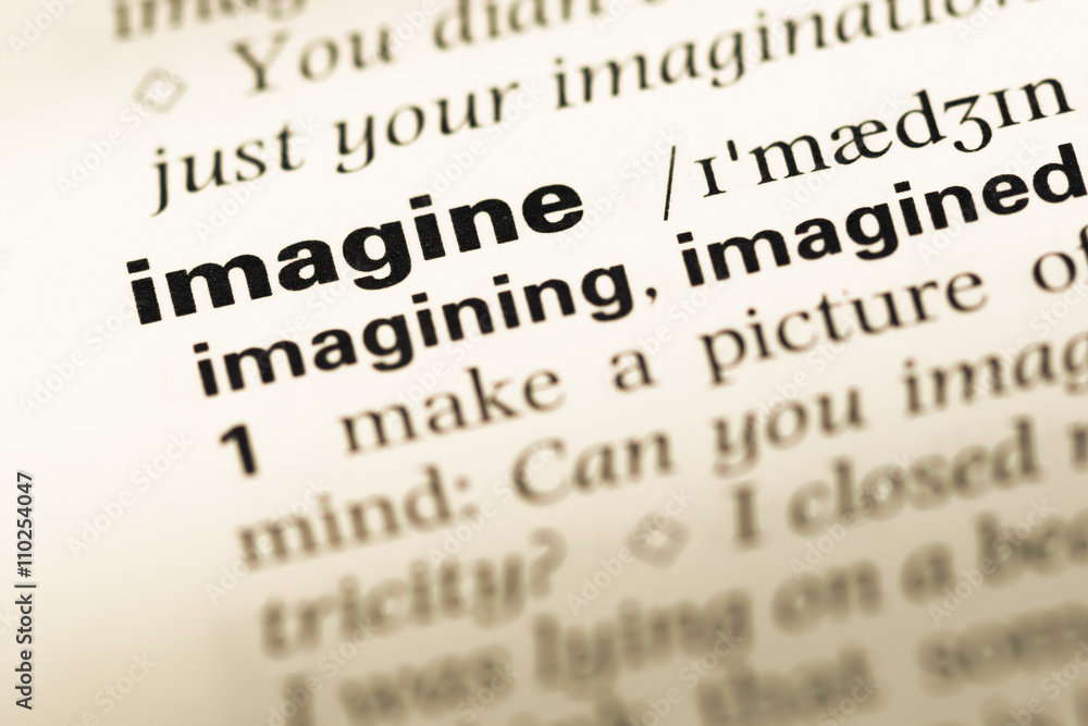 Close up of old English dictionary page with word imagine Close up of old English dictionary page with word imagine