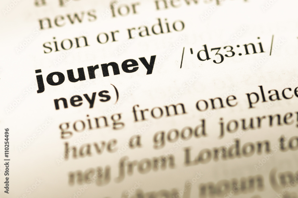 Close up of old English dictionary page with word journey Close up of old English dictionary page with word journey