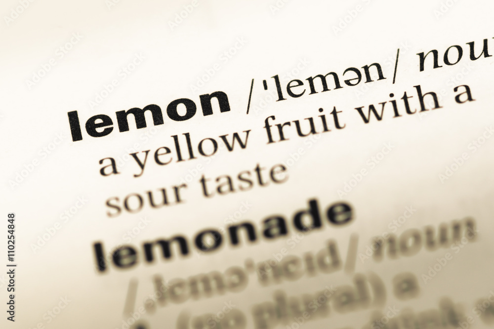 Close up of old English dictionary page with word lemon
