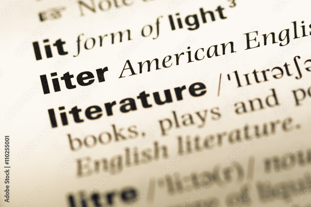 Fototapeta premium Close up of old English dictionary page with word liter