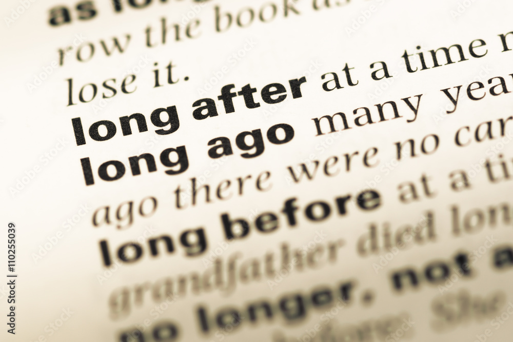 Close up of old English dictionary page with word long after Close up of old English dictionary page with word long after