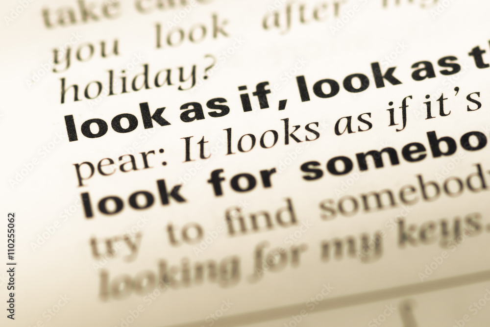 Close up of old English dictionary page with word look as if Close up of old English dictionary page with word look as if