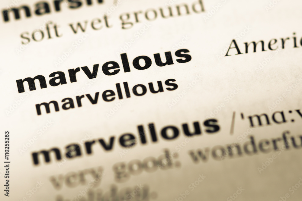 Close up of old English dictionary page with word marvelous Close up of old English dictionary page with word marvelous
