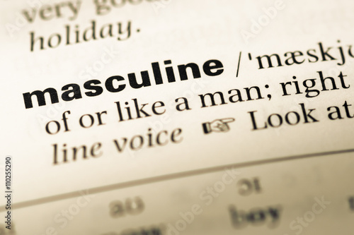 Close up of old English dictionary page with word masculine