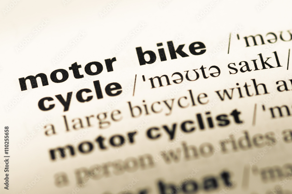 Close up of old English dictionary page with word motor bike Close up of old English dictionary page with word motor bike