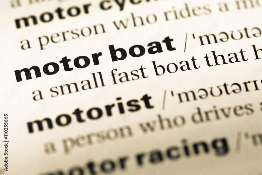 Close up of old English dictionary page with word motor boat Close up of old English dictionary page with word motor boat