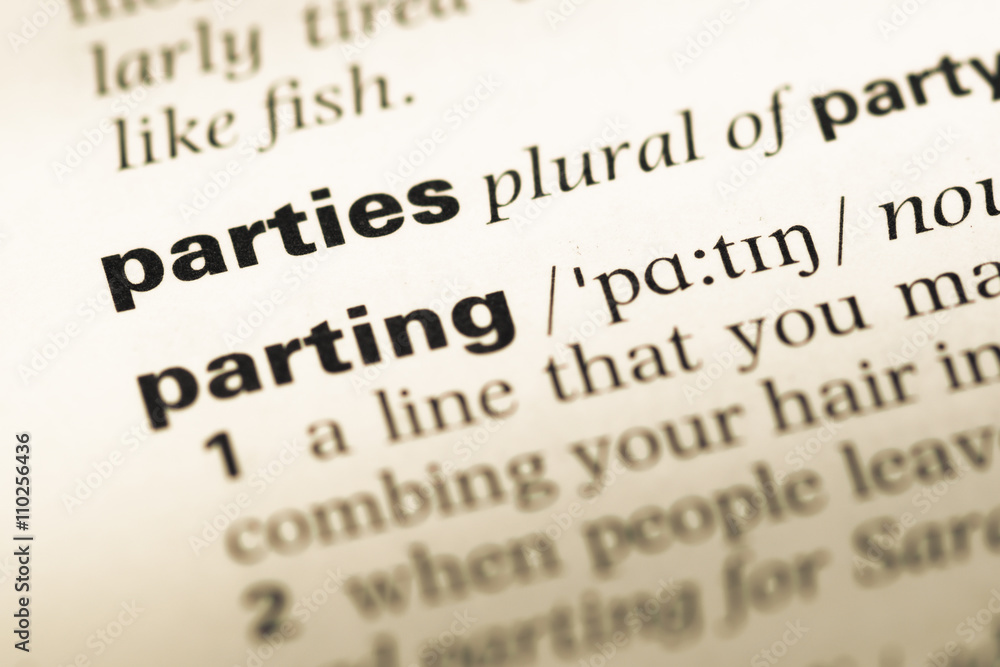 Close up of old English dictionary page with word parties Close up of old English dictionary page with word parties