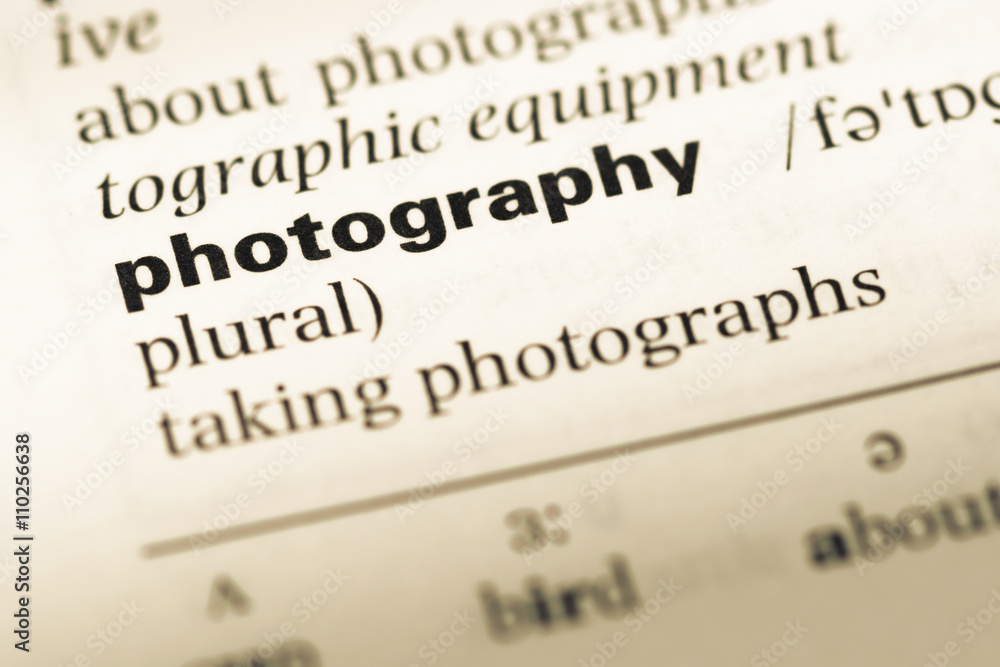 Close up of old English dictionary page with word photography Close up of old English dictionary page with word photography