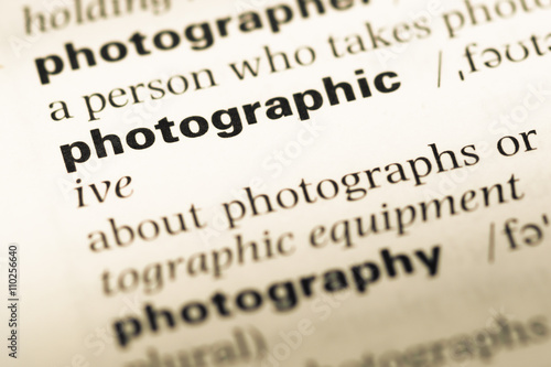 Close up of old English dictionary page with word photographic