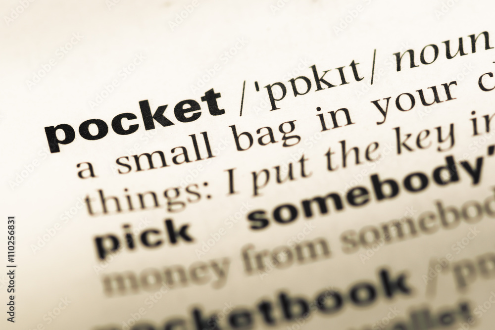 Close up of old English dictionary page with word pocket Close up of old English dictionary page with word pocket
