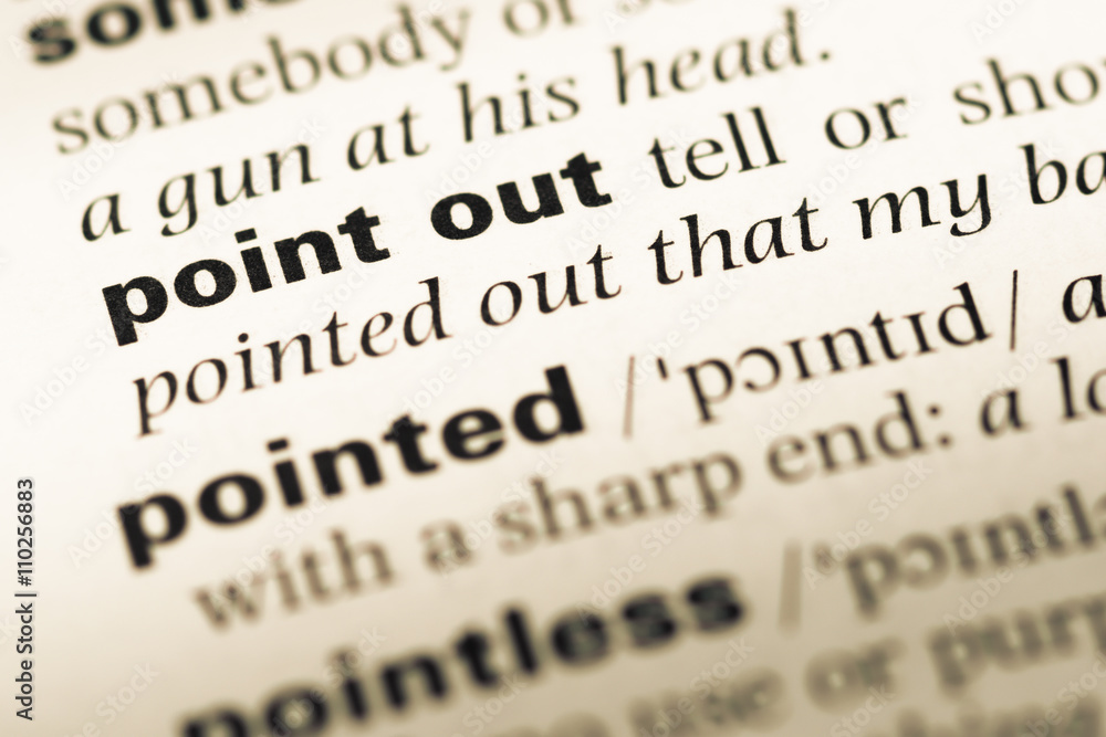 Obraz premium Close up of old English dictionary page with word point out