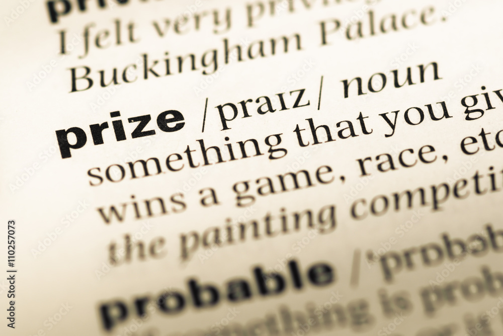 Close up of old English dictionary page with word prize Close up of old English dictionary page with word prize