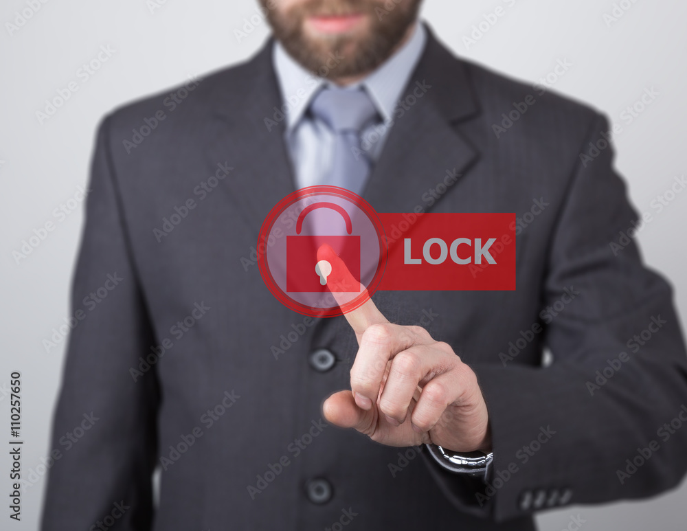 technology, internet and networking concept. man in a black business shirt. woman presses lock button on virtual screens technology, internet and networking concept. man in a black business shirt. woman presses lock button on virtual screens