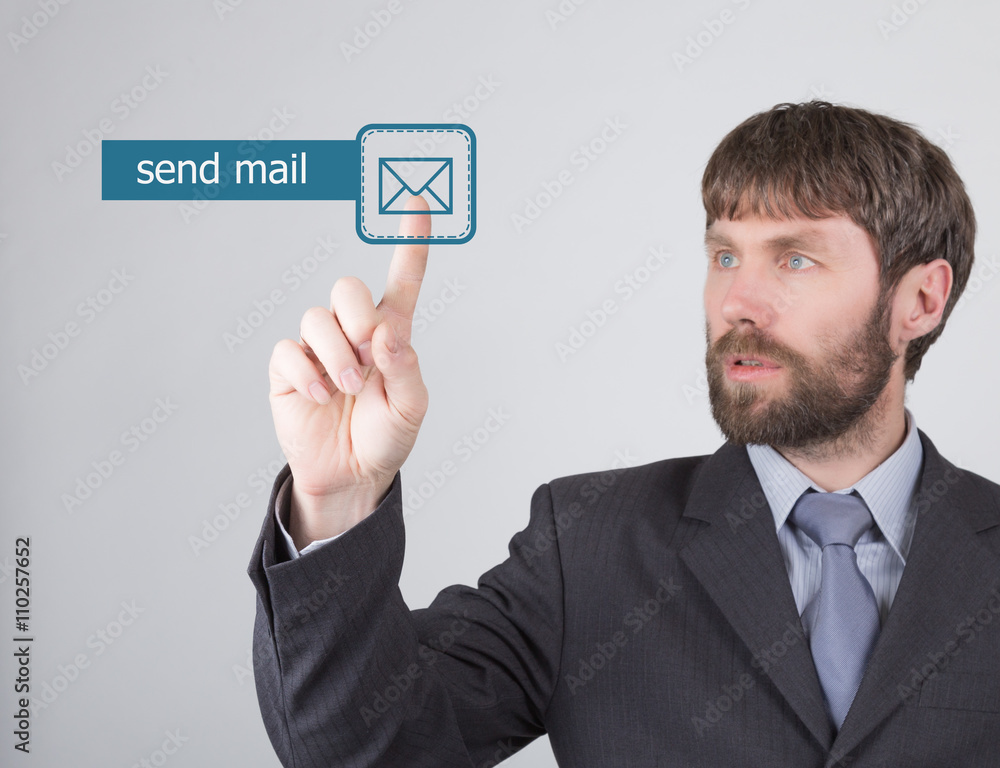 technology, internet and networking concept. man in a black business shirt. woman presses send mail button on virtual screens technology, internet and networking concept. man in a black business shirt. woman presses send mail button on virtual screens