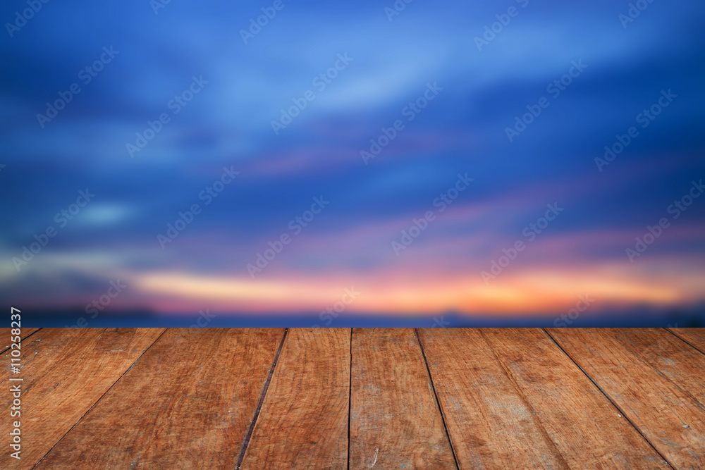 Blue sunset sky and wood floor background