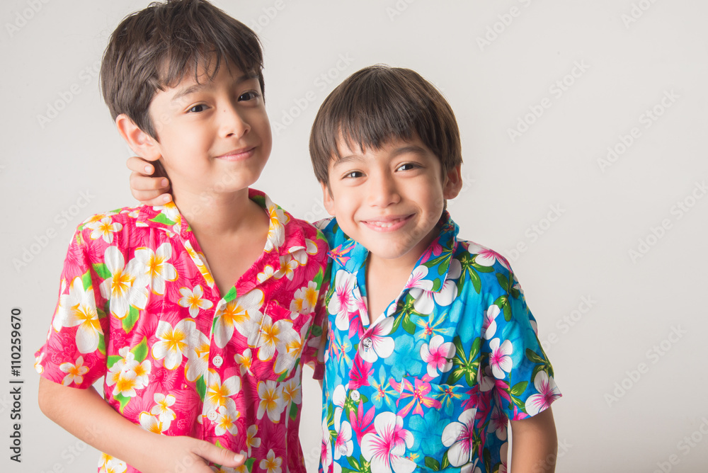 Little boy sibling boy in Thai flower dress tradition for Thai new year Little boy sibling boy in Thai flower dress tradition for Thai new year