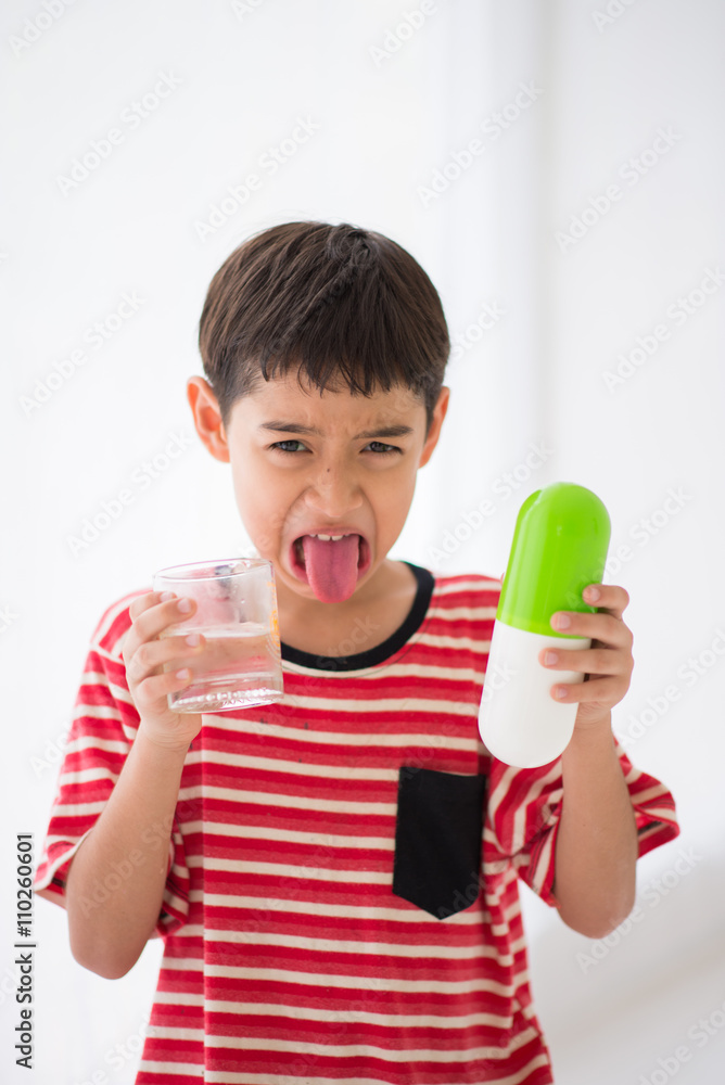 Little boy taking medicine drug Stock Photo | Adobe Stock