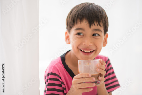 Little boy drinking milk vintage color style