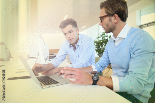 Businessmen in work meeting with laptop computer