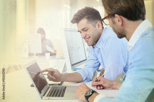 Businessmen in work meeting with laptop computer