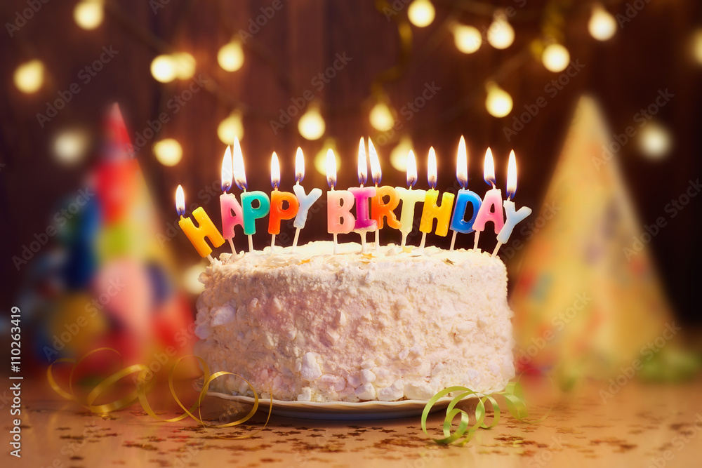 bilag grå dele Birthday cake with candles, bright lights bokeh. Stock Photo | Adobe Stock