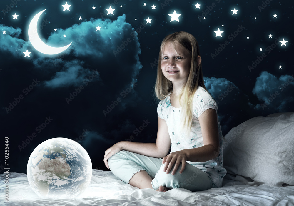 Naklejka premium Girl in her bed and glowing globe