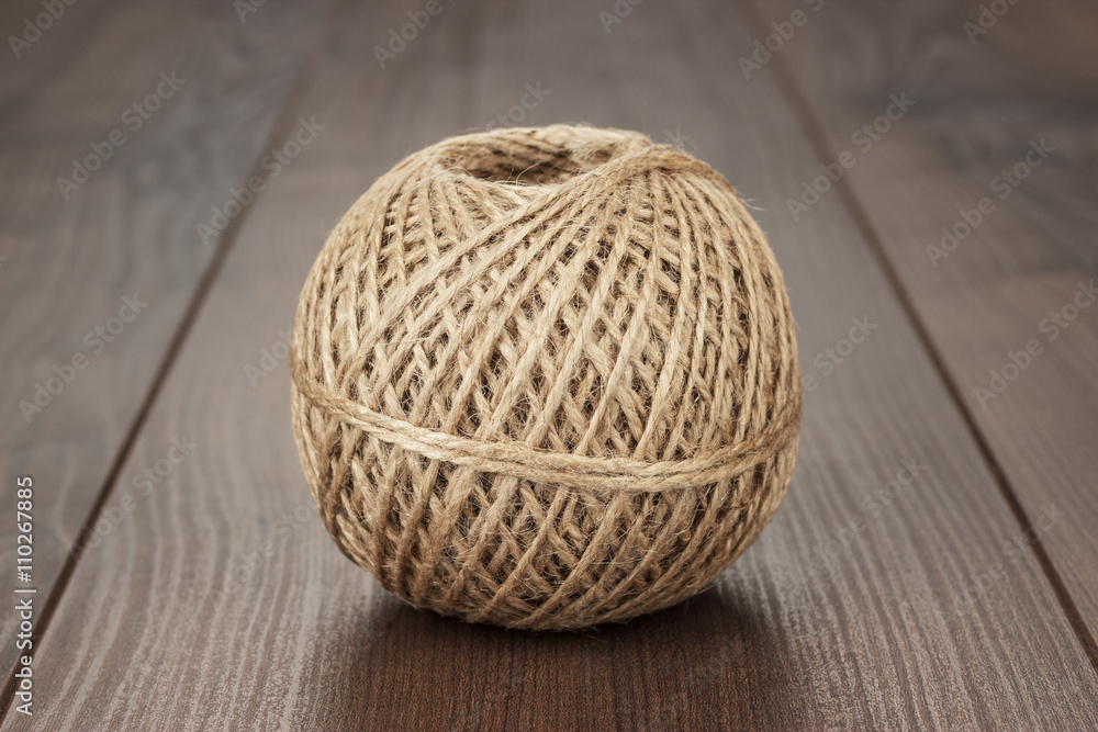 reel of durable thread on the wooden table reel of durable thread on the wooden table