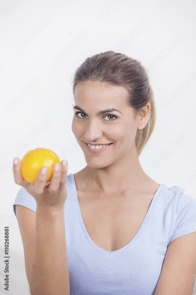 Portrait of a young beautiful woman with orange Portrait of a young beautiful woman with orange