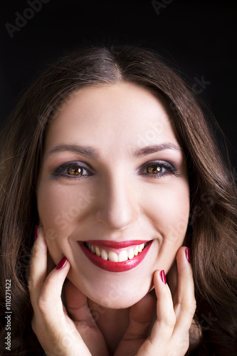 Smiling young woman - cute portrait. Natural candid adorable smile