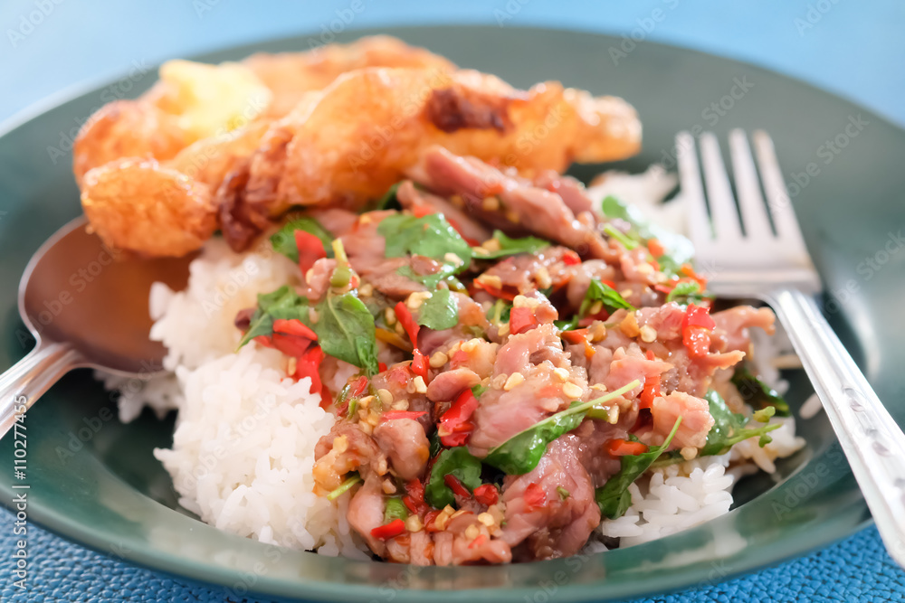 Spicy fried beef with basil leaves on dish, Food in Thailand Spicy fried beef with basil leaves on dish, Food in Thailand