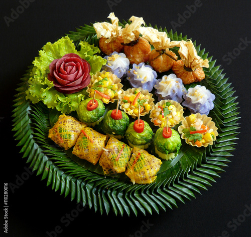 Murais de parede authentic thai cuisine - thai mixed appetizers traditional on banana leaf craft,