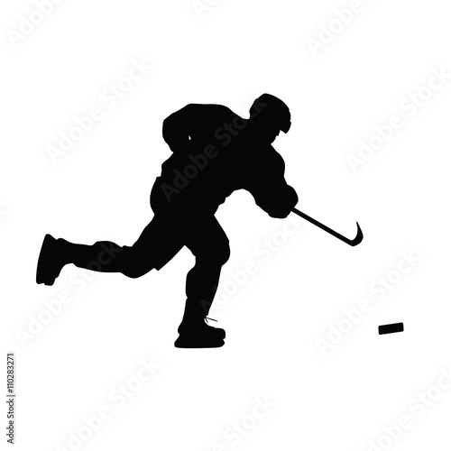 Ice hockey player vector silhouette. Hockey player shoots the pu