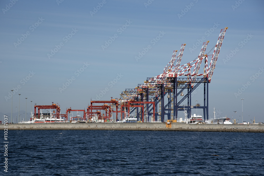 Fototapeta premium PORT OF CAPE TOWN SOUTH AFRICA - APRIL 2016 - The container port gantrys seen from across the seawall of the port