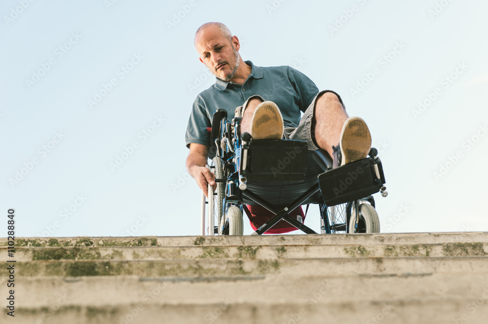Man with disease on a wheelchair Man with disease on a wheelchair