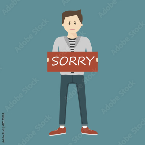 Man Holding Sorry Sign
