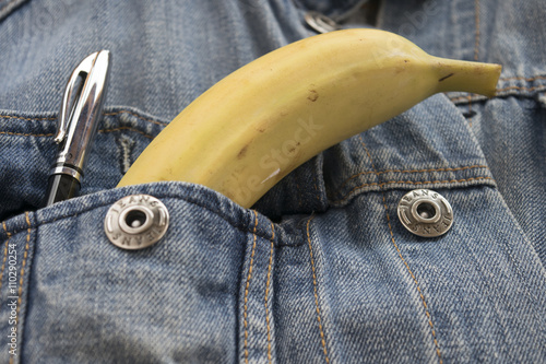 banana in the breast pocket of a jeans jacket photo
