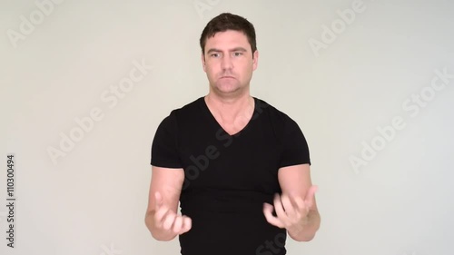 Man juggling balls and fails. He shows anger and frustration.